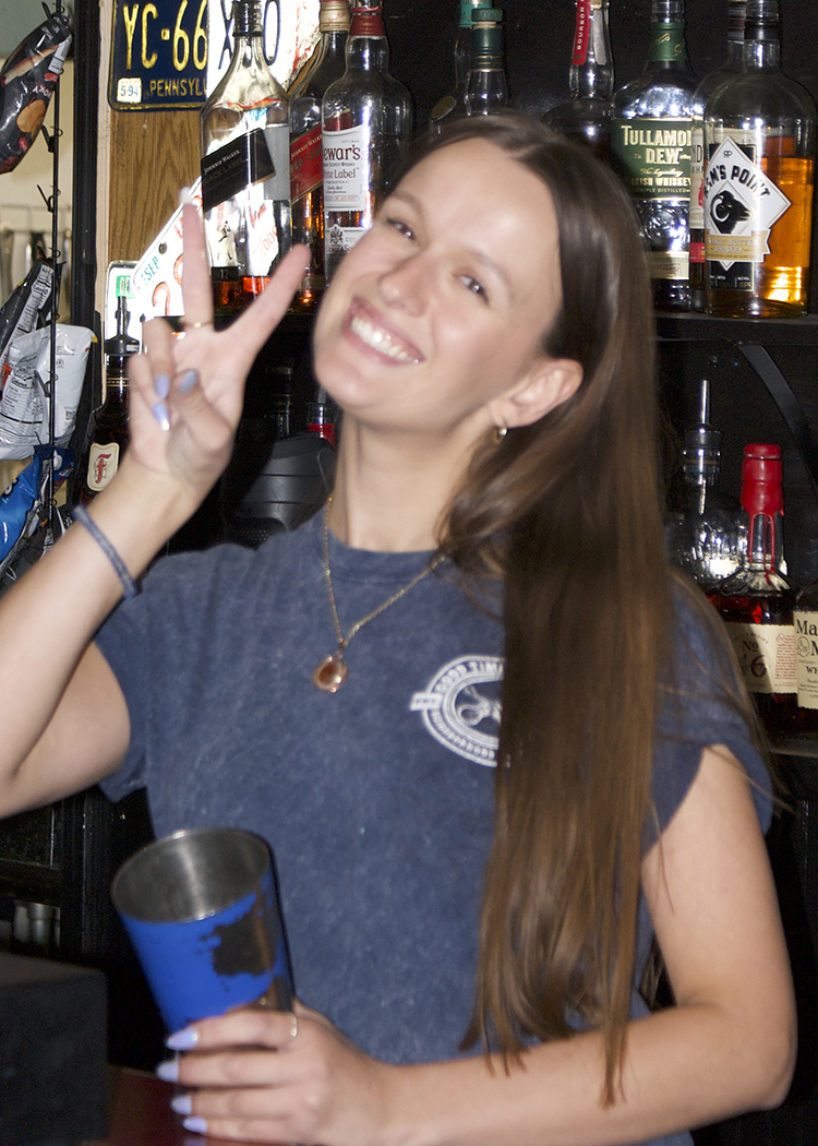 Lizzy a bartender at Brigett's Last Laugh on a Friday night